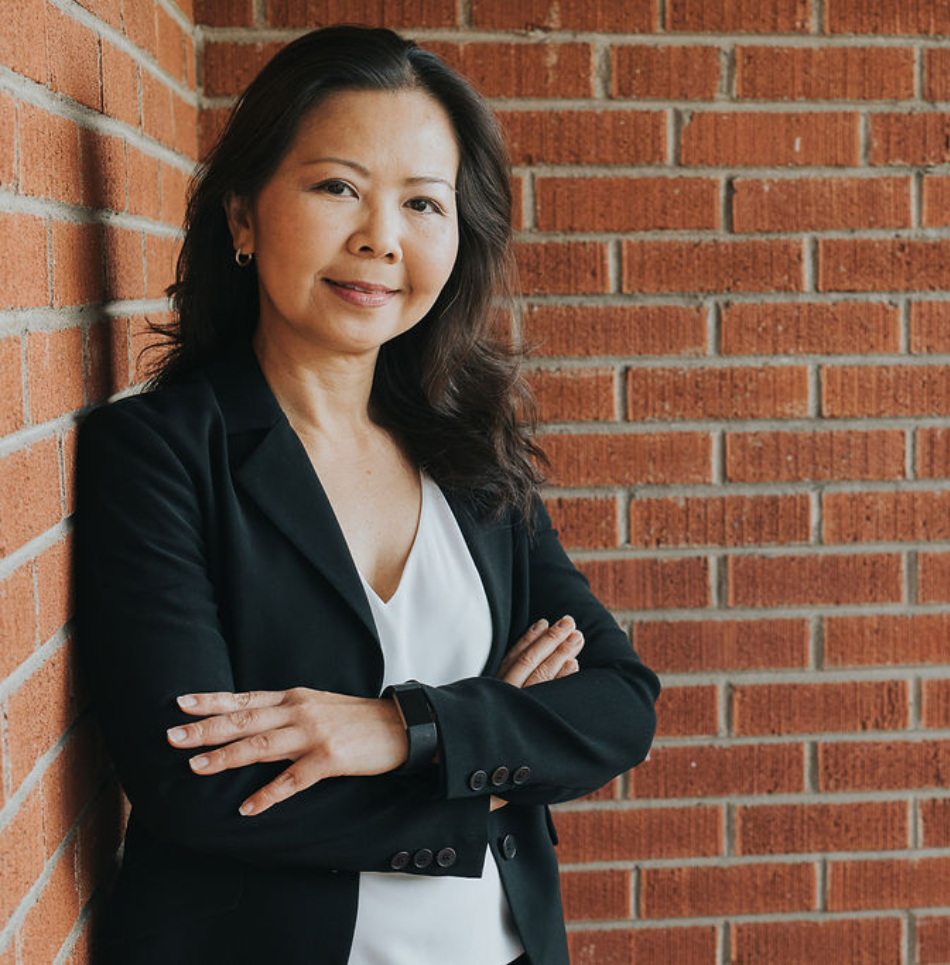 Dr. Thao Bui standing in front of Acupuncture Heals clinic in Mississauga, ON