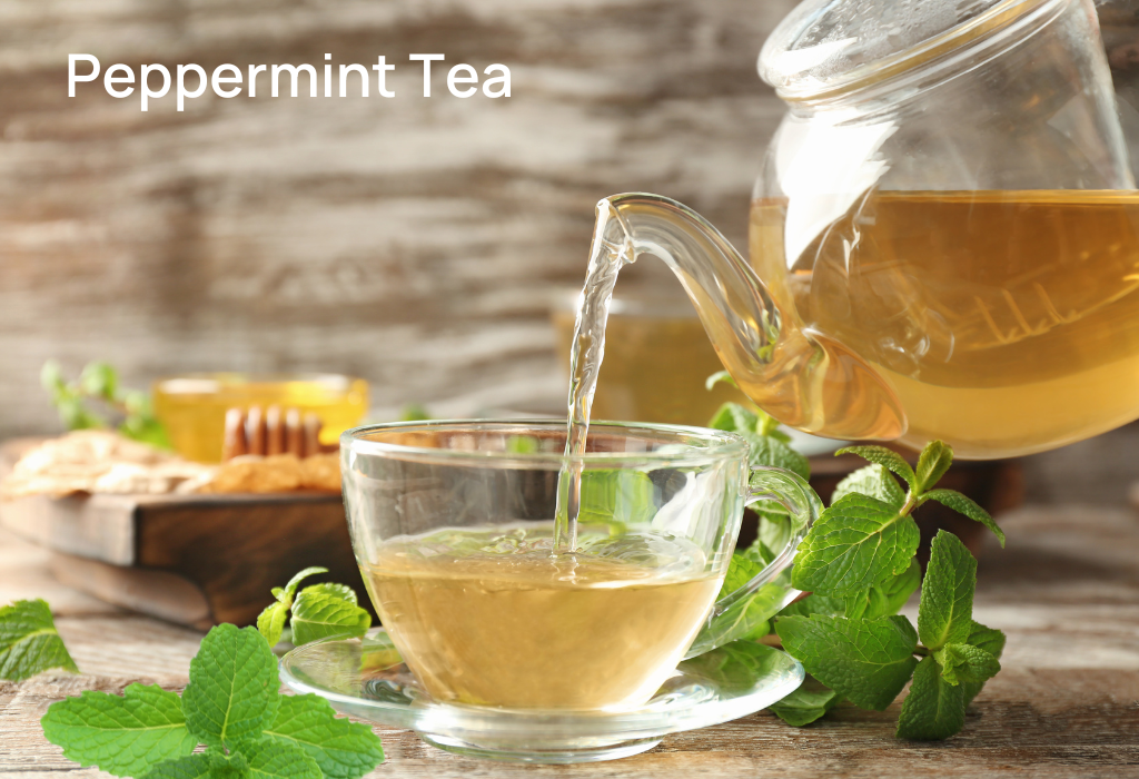 Peppermint tea in a glass cup with fresh mint leaves