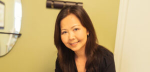 Dr. Thao Bui performing gentle cupping on a patient in the clinic