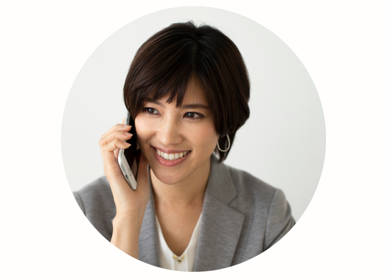 Person calling a clinic to book an appointment on a smartphone